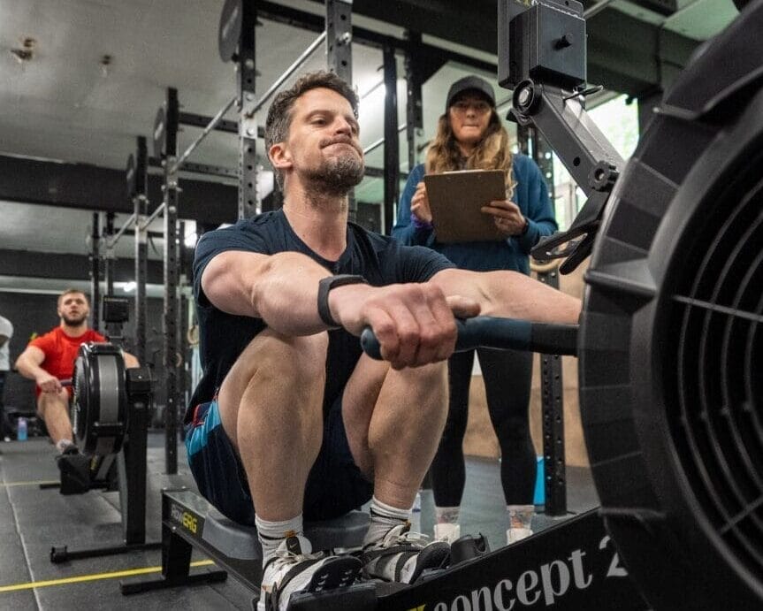Achieving Success Through Goal Setting: A 3-Part Guide 1 Man working on the rower